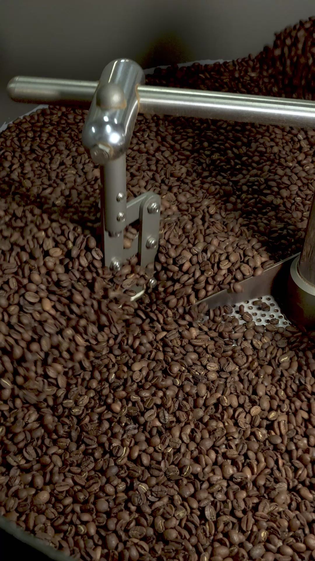 Roaster cooling down beans in a drum.